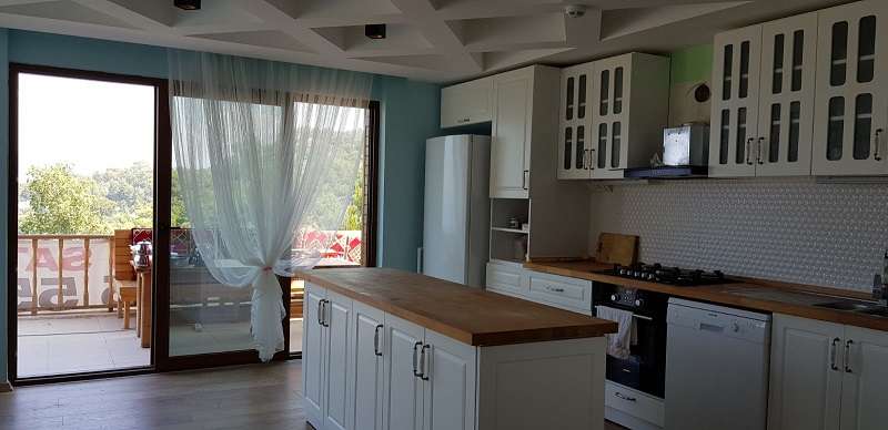 	 Sea View Stone Villa - Faralya - Kitchen with access to balcony