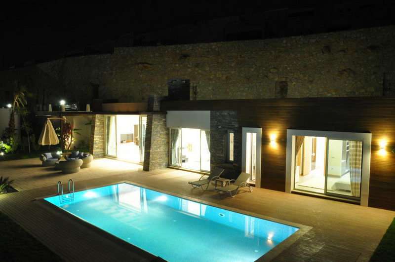 Luxury Apartment for sale in Bodrum, Konacik - night time pool