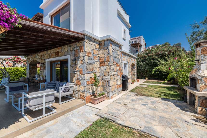 Luxurious unique villa in Gumusluk For Sale – Side of villa and gardens