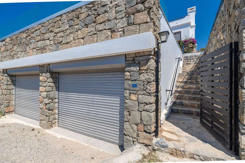 Luxurious unique villa in Gumusluk For Sale – Secure garages for two cars