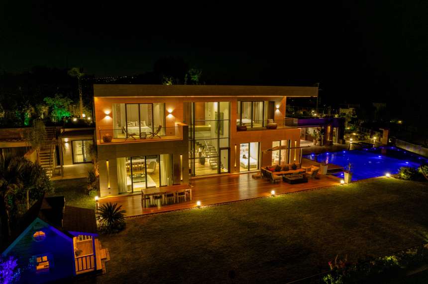 Modern Villa In Bodrum with access to private beach - Night time view of entire villa and gardens