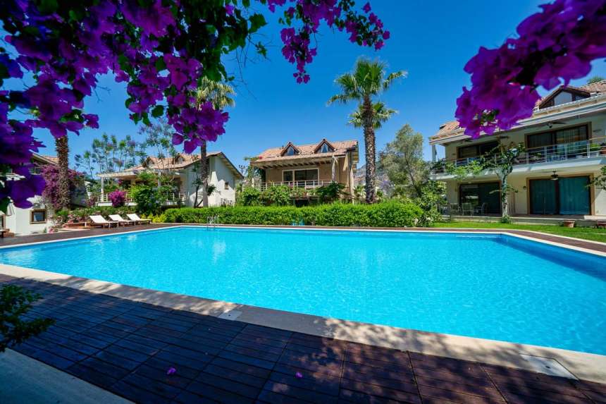 Prestigious Duplex Attic Apartment  in Gocek For Sale - Main view of Apartment and pool