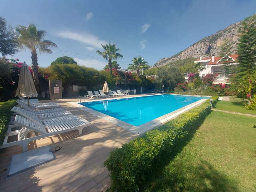 Beautiful Duplex Garden Apartment  in Gocek For Sale - Main view of communal gardens and pool