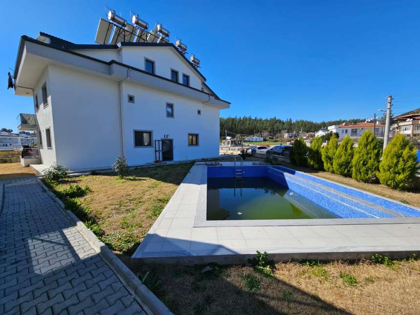 Peaceful Fethiye Property For Sale - Main view of apartment and communal pool