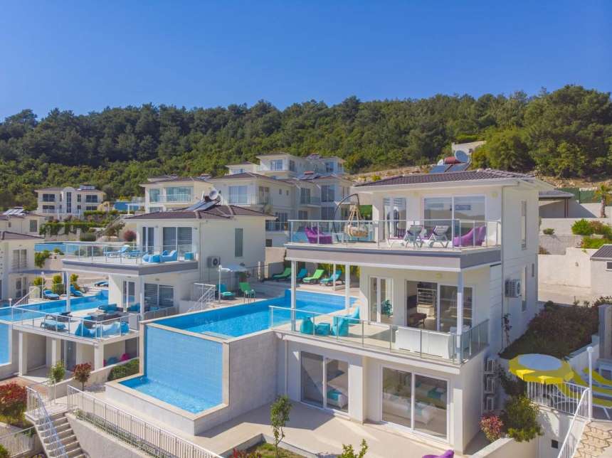 A Glamorous 4-Bedroom Fethiye Property For Sale - Main view of the triplex villa with infinity pool