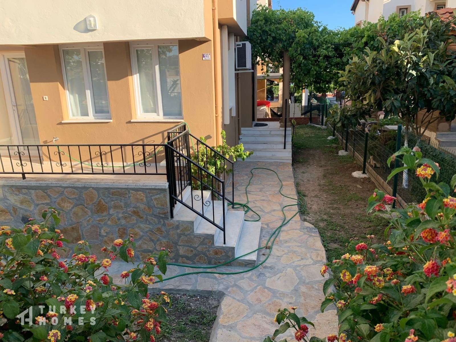 A Fully Furnished Semi-Detached Triplex Villa For Sale In Didim – Pretty gardens