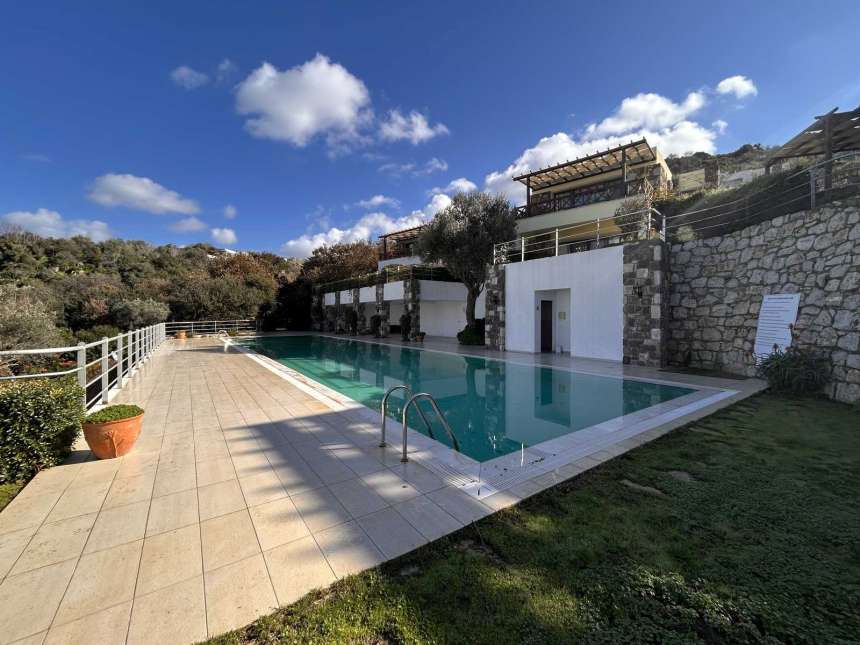 Beautiful Sea-View Apartment For Sale In Bodrum – A property with communal pool and pretty gardens