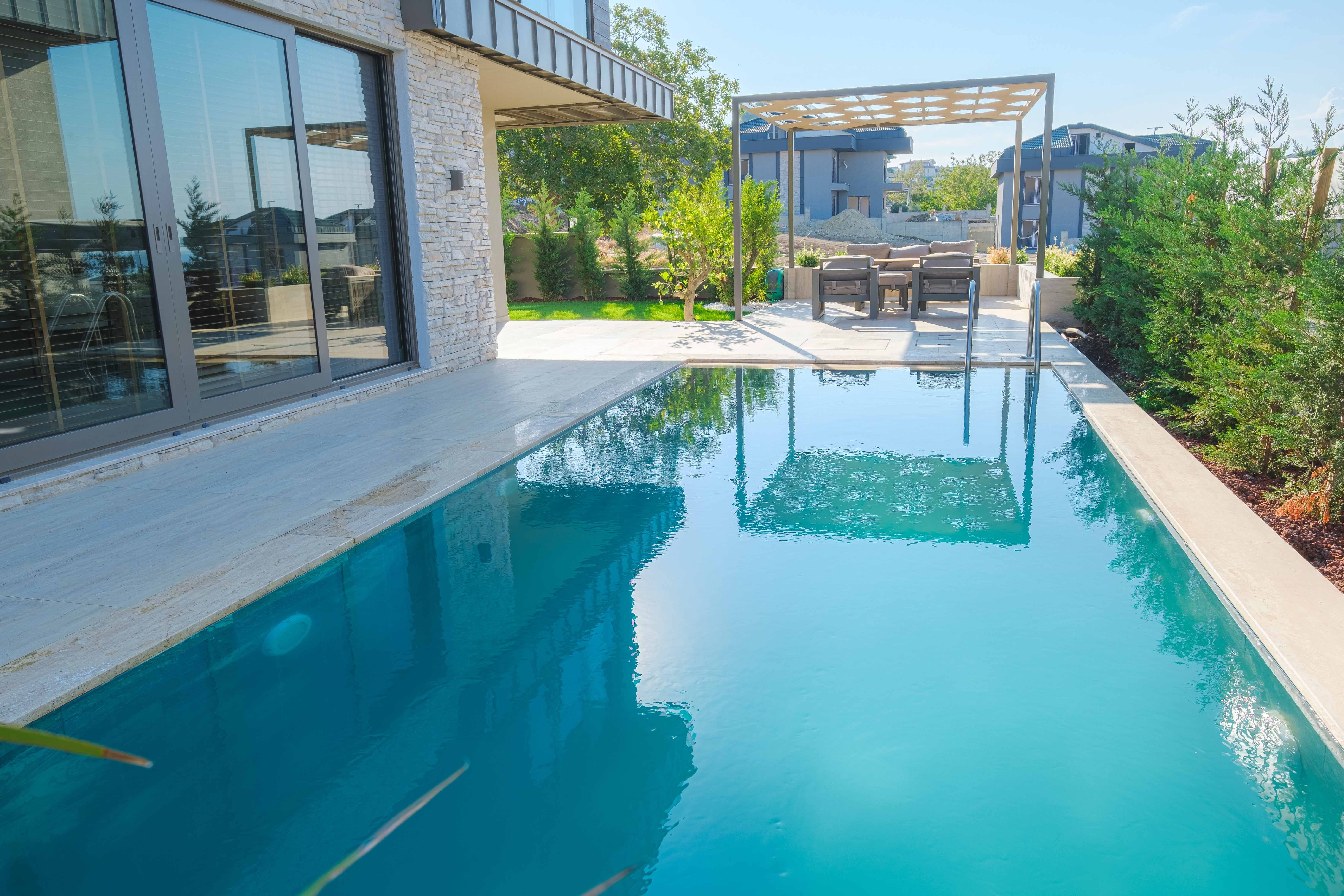 Sea View Villas For Sale in Buyukcekmece, Istanbul - A large private swimming pool with sunbathing terraces