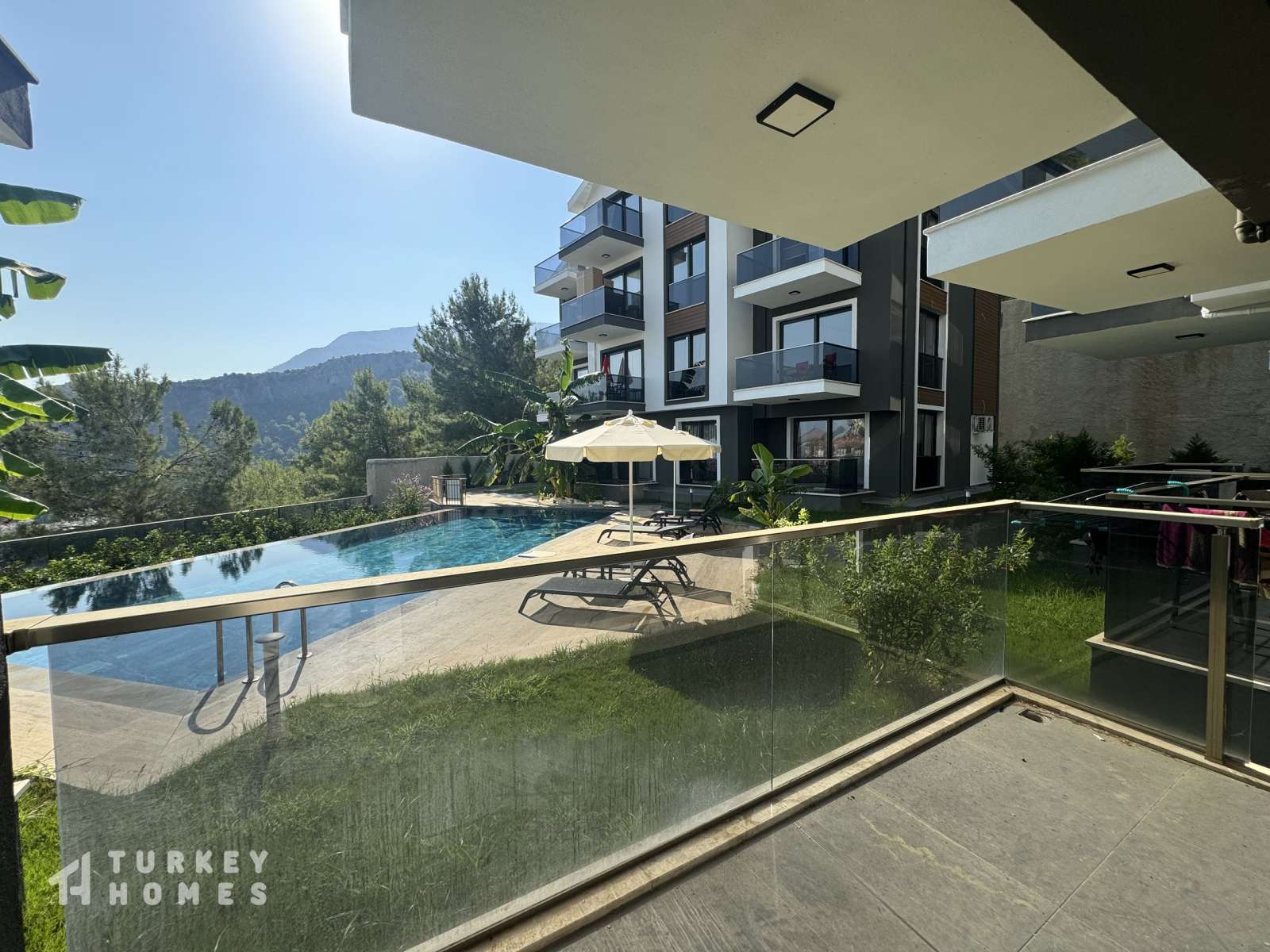 Fethiye Property With Nature Views For Sale - Gardens and pool from a balcony