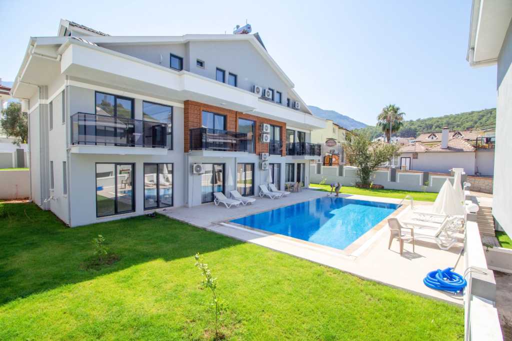 Deluxe Apartment For Sale In Ovacik, Fethiye – Shared pool and gardens