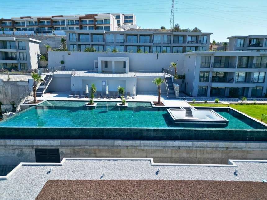 A Brand New Sunset View Apartment For Sale In Milas, Dorttepe - Main view of the complex and shared pool