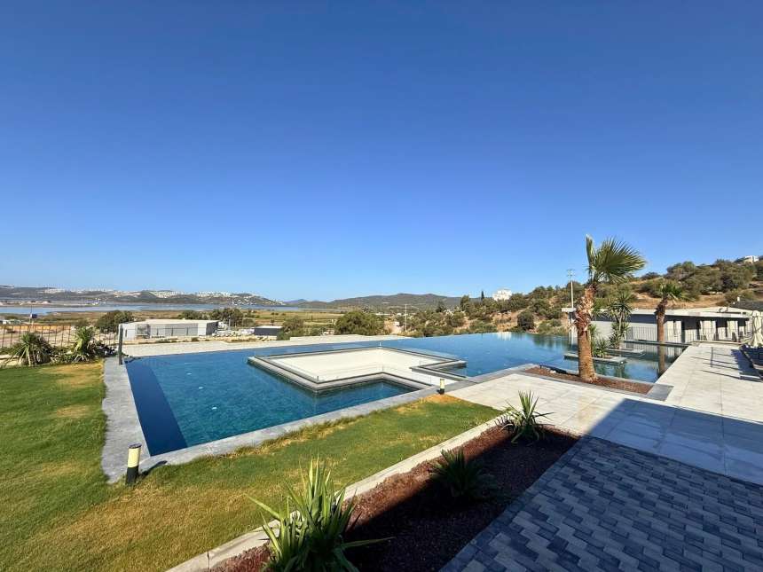 A Brand New Sunset View Apartment For Sale In Milas, Dorttepe - Communal pool and landscaped social area