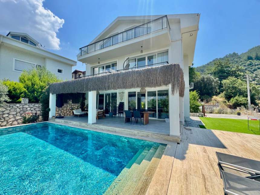 Upscale Detached Villa In Fethiye For Sale - Main view of the villa and infinity pool